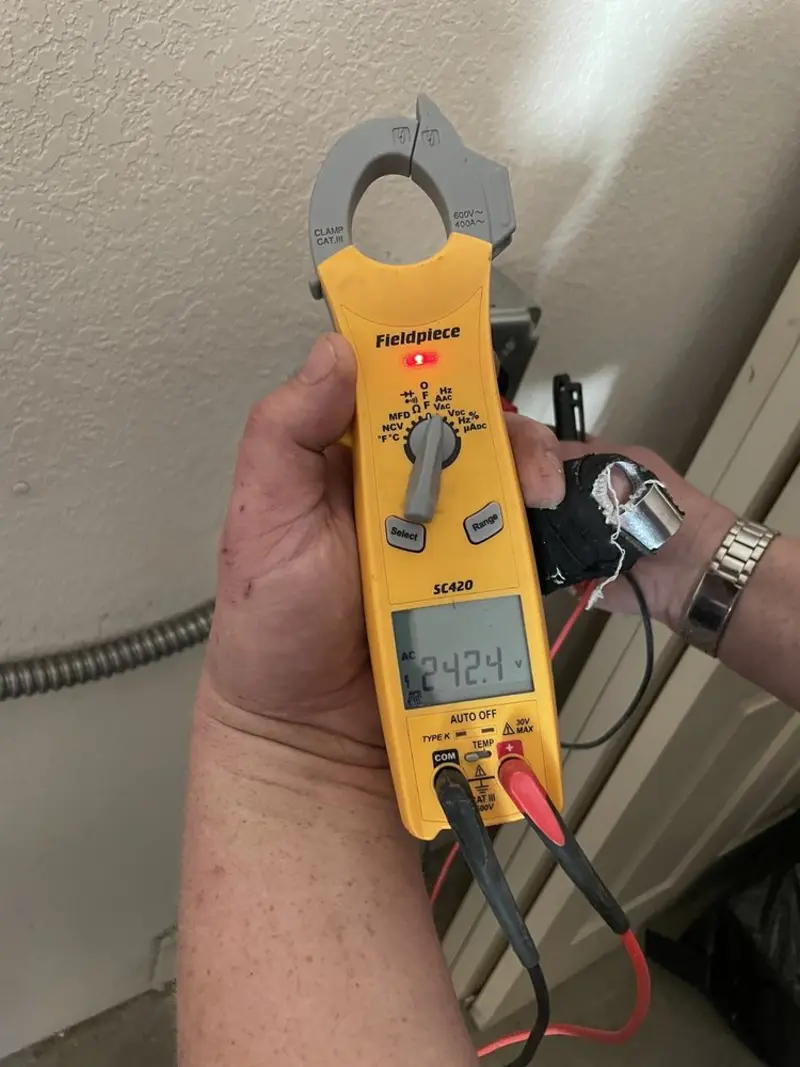 Voltage testing with clamp meter during Generator Installation in Fort Worth